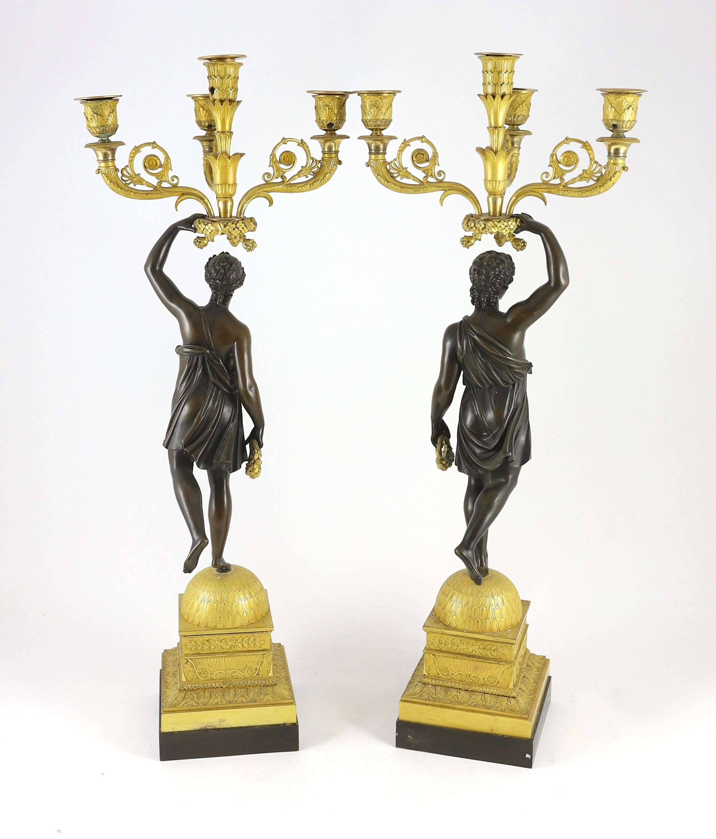 A pair of 19th century French Empire style bronze and ormolu four light candelabra, 25cm wide, 68cm high